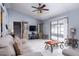 Spacious living room with tile floors, ceiling fan, and patio access at 741 Caribou Dr, Kissimmee, FL 34759