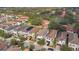 Aerial view of a neighborhood with well-maintained homes, green lawns, and tree-lined streets at 8197 Via Vittoria Way, Orlando, FL 32819