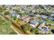Aerial view showcasing a single-Gathering home with a large backyard and canal views at 849 Jarnac Dr, Kissimmee, FL 34759