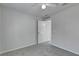 Bedroom with neutral walls, carpet, and door to hallway at 849 Jarnac Dr, Kissimmee, FL 34759