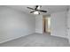 Bright bedroom featuring gray carpet and ceiling fan at 849 Jarnac Dr, Kissimmee, FL 34759