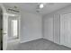 Bedroom with neutral walls, carpet, and double doors at 849 Jarnac Dr, Kissimmee, FL 34759