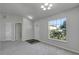 Dining room with large window, gray carpet, and neutral walls at 849 Jarnac Dr, Kissimmee, FL 34759