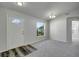 Entryway with wood-look flooring and white door at 849 Jarnac Dr, Kissimmee, FL 34759