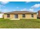 Tan house exterior with backyard at 849 Jarnac Dr, Kissimmee, FL 34759