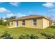 Tan house exterior with backyard at 849 Jarnac Dr, Kissimmee, FL 34759