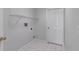 Bright laundry room with tile floor, shelving, and a washer/dryer hookup at 849 Jarnac Dr, Kissimmee, FL 34759