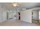 Open living space with gray carpet and kitchen views at 849 Jarnac Dr, Kissimmee, FL 34759