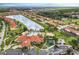 Aerial view of community with lake and amenities at 1041 Las Fuentes Dr, Kissimmee, FL 34746