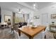Bright dining area with wooden table and chairs, adjacent to living room at 1041 Las Fuentes Dr, Kissimmee, FL 34746