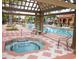 Community hot tub with pergola cover at 1041 Las Fuentes Dr, Kissimmee, FL 34746