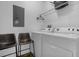 Laundry room with washer, dryer, and shelving at 1041 Las Fuentes Dr, Kissimmee, FL 34746