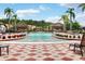 Relaxing pool area with lounge chairs and shade structures at 1041 Las Fuentes Dr, Kissimmee, FL 34746