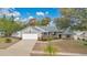 House with driveway and landscaping, aerial view at 1108 Climbing Rose Dr, Orlando, FL 32818