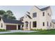 Beautiful white brick home with a connecting covered walkway to the garage at 1112 Sarah Mathews Dr, Oakland, FL 34787
