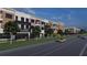 Modern mixed-use buildings with retail stores, apartments, and well-maintained streetscape creating a vibrant urban community at 1112 Sarah Mathews Dr, Oakland, FL 34787