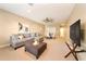 Finished basement featuring a comfortable sitting area and TV at 1519 Lake Rhea Dr, Windermere, FL 34786