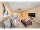 Finished basement with sectional sofa, coffee table, and dining area at 1519 Lake Rhea Dr, Windermere, FL 34786