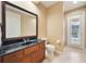 Bathroom with walk-in shower, vanity, and pool view at 1519 Lake Rhea Dr, Windermere, FL 34786