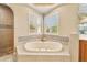 Spa-like bathroom with soaking tub and shower at 1519 Lake Rhea Dr, Windermere, FL 34786