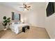 Spacious bedroom with king-size bed, large window, and ceiling fan at 1519 Lake Rhea Dr, Windermere, FL 34786