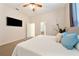 Bright bedroom with a queen-size bed and plenty of natural light at 1519 Lake Rhea Dr, Windermere, FL 34786