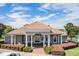 Community clubhouse with inviting entrance and landscaping at 1519 Lake Rhea Dr, Windermere, FL 34786