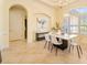 Bright dining room with marble table and modern chairs, features large window at 1519 Lake Rhea Dr, Windermere, FL 34786