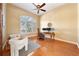 Home office with wood floors, large window, and built-in desk at 1519 Lake Rhea Dr, Windermere, FL 34786