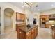 Gourmet kitchen with granite island and wood cabinets at 1519 Lake Rhea Dr, Windermere, FL 34786