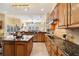 Modern kitchen with stainless steel appliances and granite counters at 1519 Lake Rhea Dr, Windermere, FL 34786