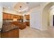 Kitchen features granite counters, custom cabinetry, and breakfast bar at 1519 Lake Rhea Dr, Windermere, FL 34786
