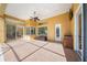 Covered lanai with tile floor, ceiling fan, and pool access at 1519 Lake Rhea Dr, Windermere, FL 34786