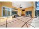 Spacious lanai with tile flooring, ceiling fan, and outdoor kitchen at 1519 Lake Rhea Dr, Windermere, FL 34786