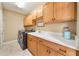 Laundry room with washer, dryer, cabinets, and utility sink at 1519 Lake Rhea Dr, Windermere, FL 34786