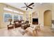 Spacious living room featuring a cozy seating area and a fireplace at 1519 Lake Rhea Dr, Windermere, FL 34786