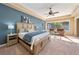Main bedroom with a king-size bed and sitting area at 1519 Lake Rhea Dr, Windermere, FL 34786