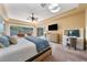 Main bedroom with vanity and access to the pool at 1519 Lake Rhea Dr, Windermere, FL 34786