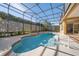 Refreshing screened pool and spa with a view at 1519 Lake Rhea Dr, Windermere, FL 34786