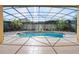 Relaxing screened pool with spa and ample deck space at 1519 Lake Rhea Dr, Windermere, FL 34786