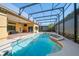 Inviting screened pool and spa with surrounding lanai at 1519 Lake Rhea Dr, Windermere, FL 34786