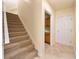 Carpeted staircase leading to upper level with storage at 1519 Lake Rhea Dr, Windermere, FL 34786