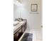 Double vanity bathroom with granite countertop at 1582 Moon Valley Dr, Champions Gate, FL 33896