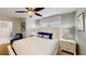 Main bedroom with a queen bed, nightstands, and ceiling fan at 1582 Moon Valley Dr, Champions Gate, FL 33896