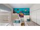 Bedroom with twin beds and ocean-themed mural at 1582 Moon Valley Dr, Champions Gate, FL 33896
