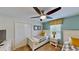 Twin bedroom with window and ceiling fan at 1582 Moon Valley Dr, Champions Gate, FL 33896