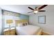 Cozy bedroom with ceiling fan and window coverings at 1582 Moon Valley Dr, Champions Gate, FL 33896