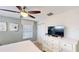 Bright bedroom with a TV, dresser, and comfortable bed at 1582 Moon Valley Dr, Champions Gate, FL 33896
