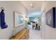 Bright entryway with mirror, console table, and view of dining area at 1582 Moon Valley Dr, Champions Gate, FL 33896