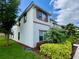 Exterior view of two-story home with landscaping at 1582 Moon Valley Dr, Champions Gate, FL 33896